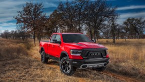 An image of a Ram 1500 parked outside on a field.