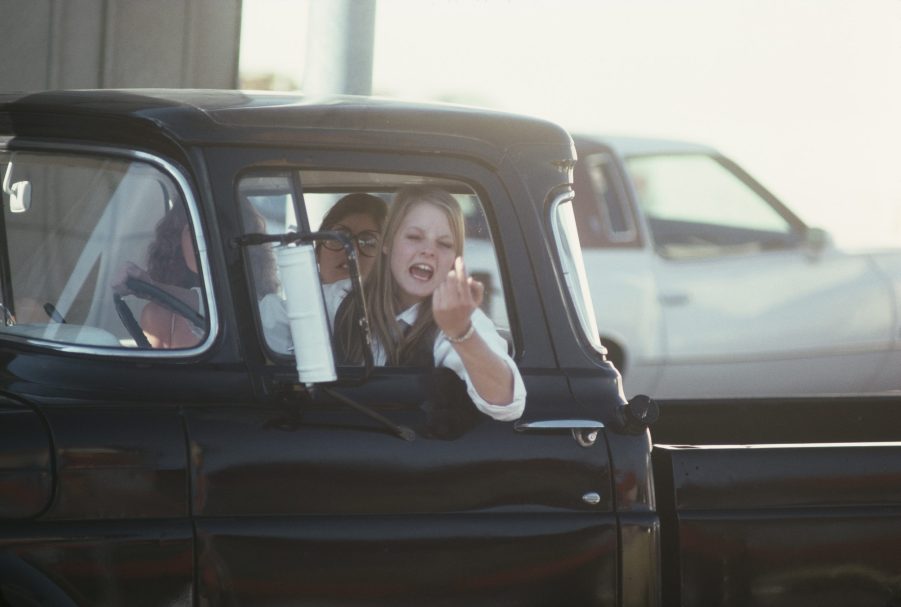 Actress yells out her truck window.