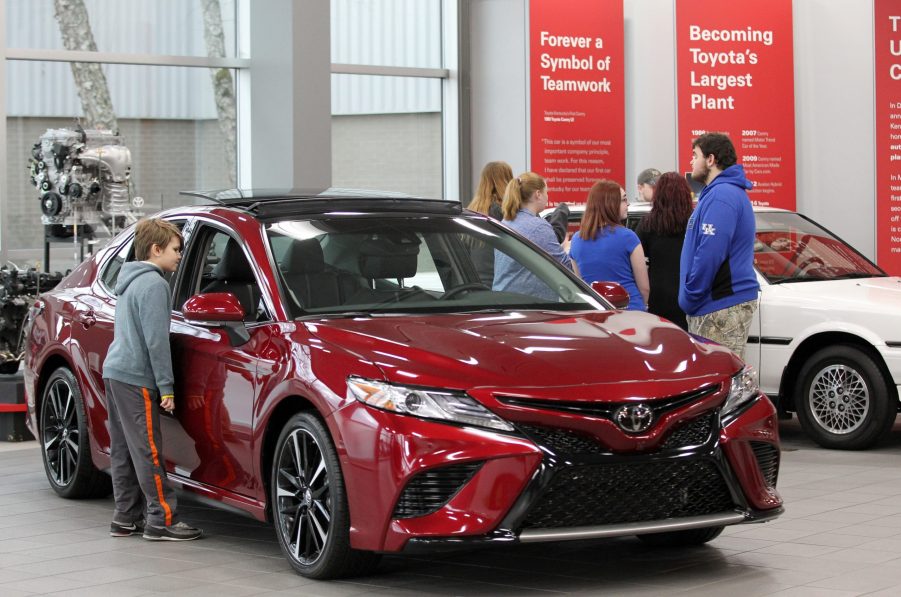 Visitors to the Toyota Motor Manufacturing plant look over the 2019 Toyota Camry