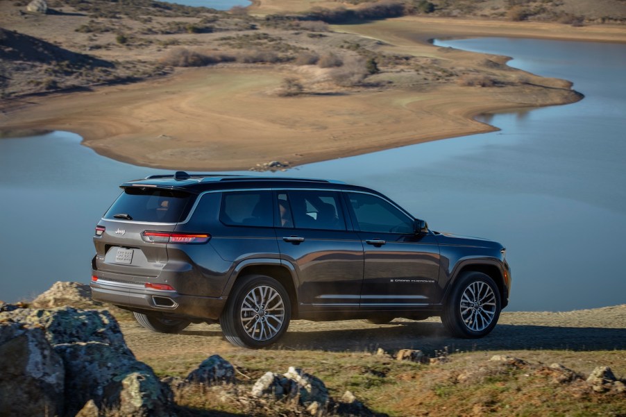 A brown 2021 Jeep Grand Cherokee L Summit Reserve by a desert lake