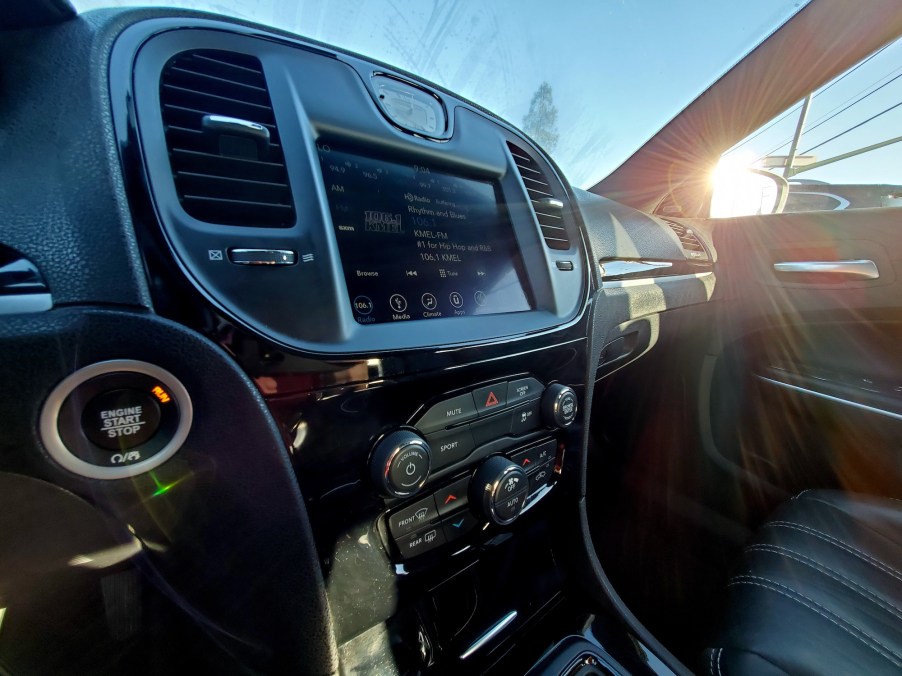 View of a Chrysler automobile's interior features with the sun shining through the window