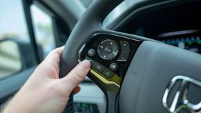 Close-up of hand of a man using handsfree Bluetooth calling feature on Honda automobile, San Ramon, California, March 25, 2020. (Photo by Smith Collection/Gado/Getty Images)