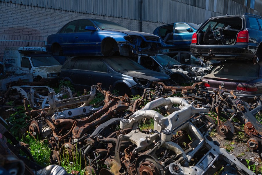 Scrap yard filled with old cars. Salvage title