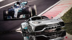 An image of a Mercedes-AMG One on a stage with an image of an F1 car behind it.