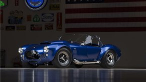 The blue 1966 Shelby Cobra 427 Super Snake in a dimly-lit garage