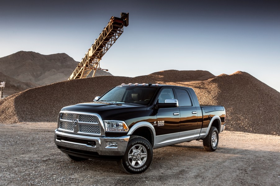 A black and silver 2016 Ram 2500 Laramie Crew Cab 4x4 Heavy Duty with a Cummins Diesel engine