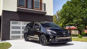 A black Toyota Sienna minivan parked in a driveway.