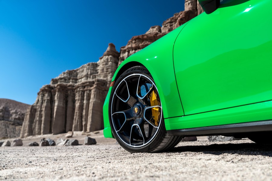 A 2021 911 Turbo S in Python Green parked in a desert