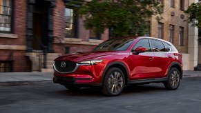 A red 2021 Mazda CX-5 parked on a street.