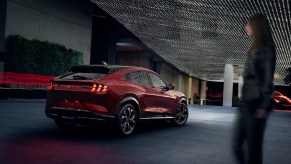 The rear 3/4 view of a red 2021 Ford Mustang Mach-E Premium