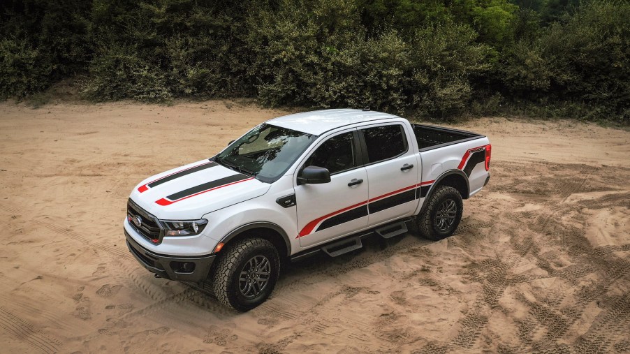 A white 2021 Ford Ranger Tremor XLT off-road pickup truck with black and red sticker details