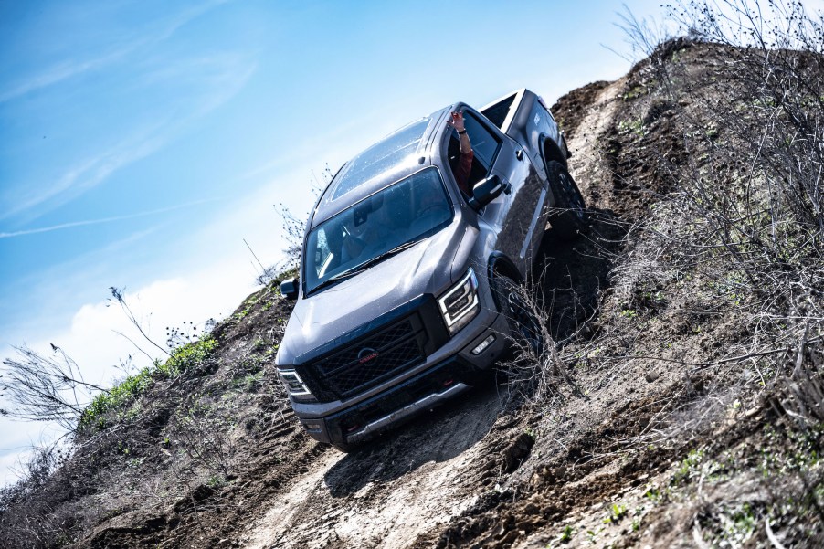 A 2021 Nissan Titan navigates a steep hill