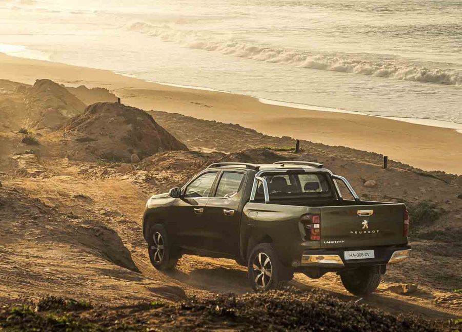 2021 Peugeot Landtrek pickup crew cab at the beach rear 3/4