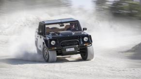 An image of a Lamborghini LM002 out on the road.