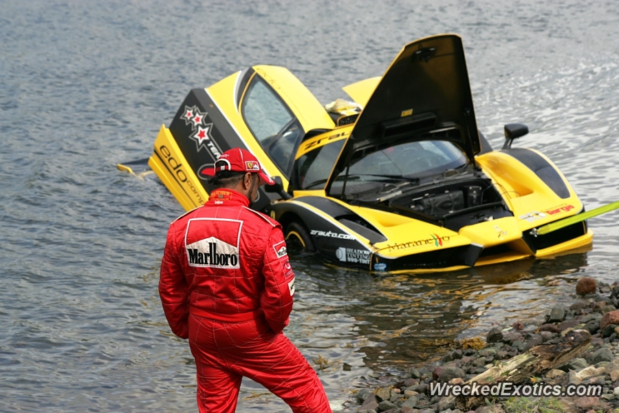 An image of a Ferrari Enzo FXX stuck in a lake.