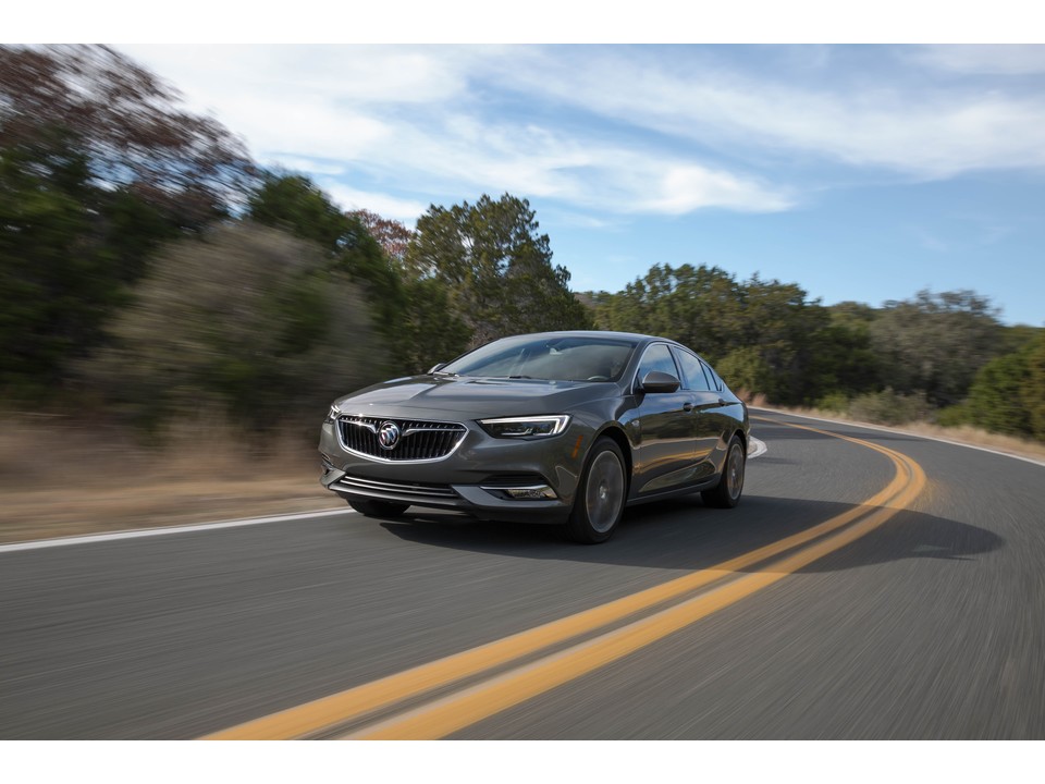 2020 Buick Regal luxury car at speed on a scenic road