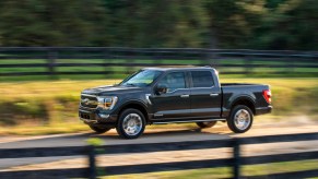 2021 Ford F-150 driving down a country road