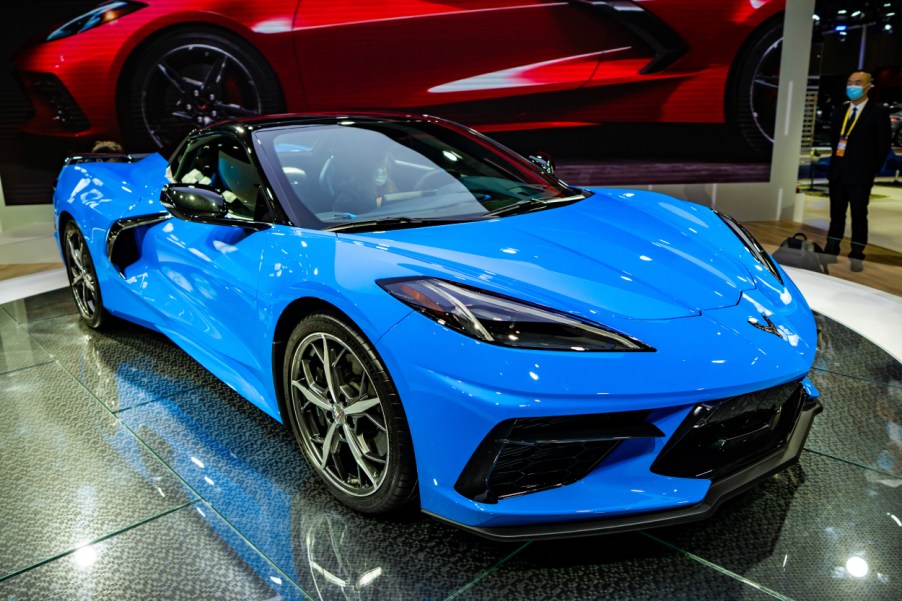 A blue Chevy Corvette on display at an auto show