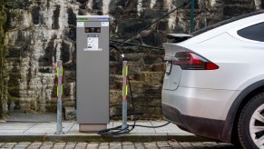 A Tesla is plugged in to an electric vehicle charger in Stavanger, Norway