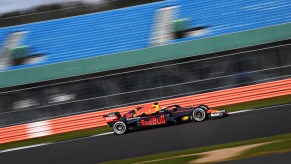 A Red Bull Racing Formula 1 car driving down the track.