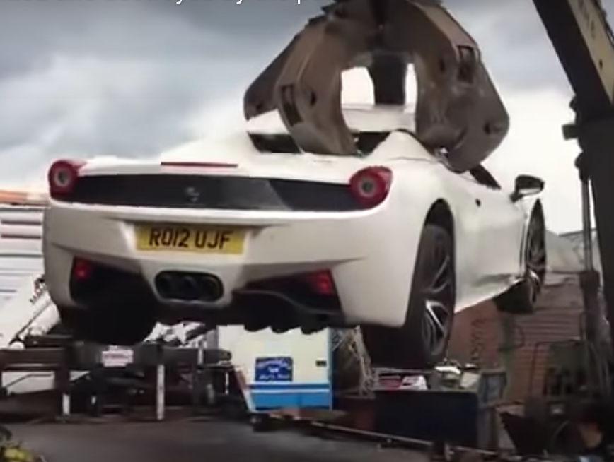 Crushed 458 Ferrari in scrap yard claws