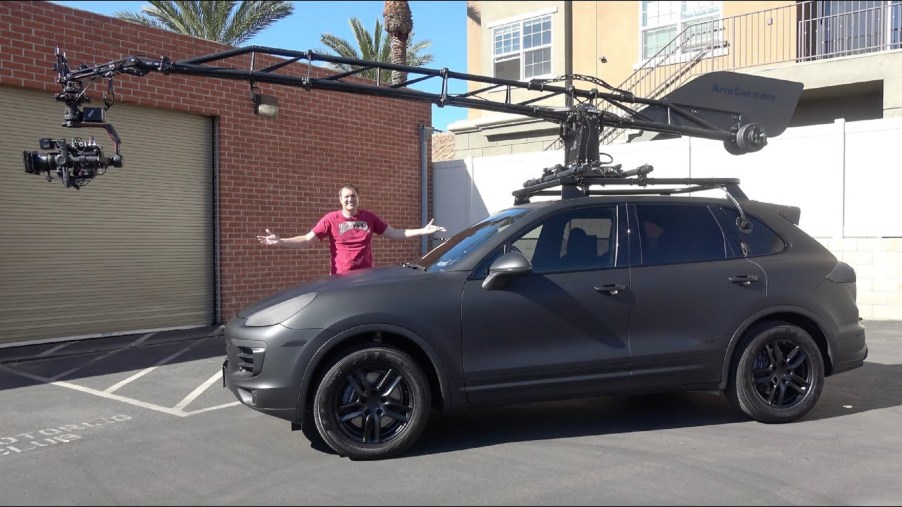 Doug DeMuro with the modified matte-black Porsche Cayenne 'Arm Car'