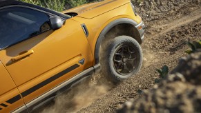 Yellow 2021 Ford Bronco Sport driving uphill