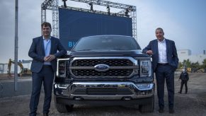 Ford CEO Jim Farley, left, and Executive Chairman of Ford Bill Ford pose for a photo with the 2021 Ford F-150 King Ranch Truck at the Ford Built for America event at Ford’s Dearborn Truck Plant on September 17, 2020 i