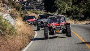 several Glickenhaus Boots on winding road