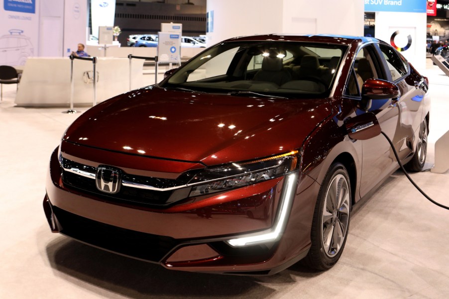 A Honda Clarity Plug-In Hybrid on display at an auto show