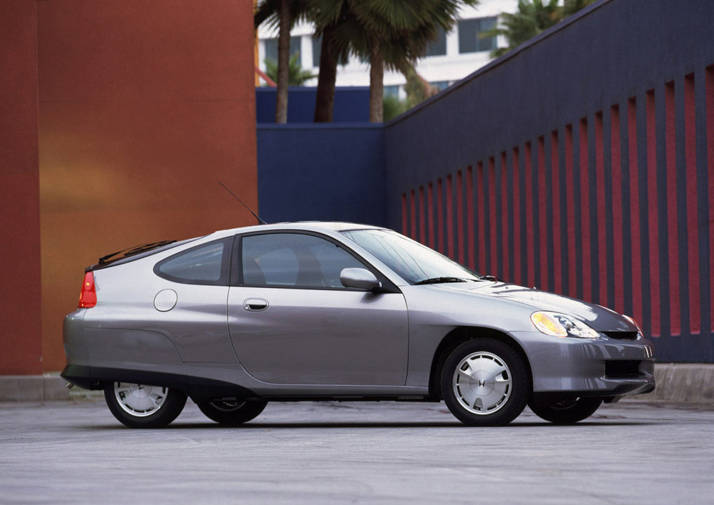 A silver 2000 Honda Insight  posing