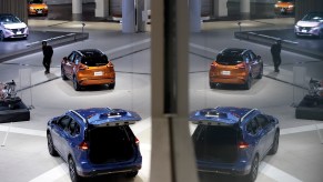 A visitor looks at a Nissan Kicks crossover sport utility vehicle (SUV) on display inside a showroom at the company's global headquarters