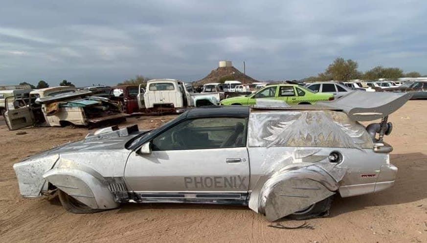 Pontiac Firebird Phoenix sitting in wrecking yard