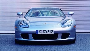 An image of a Porsche Carrera GT parked outside.