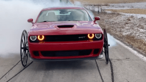 An image of a Dodge Challenger Hellcat with Buggy Wheels.