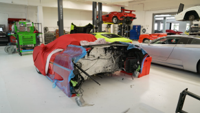 An image of a Ferrari F50 split in half for a service.