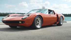 An image of a Lamborghini Miura S driving through Miami, FL.