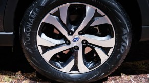 The tire on a Subaru Outback displayed at an auto show