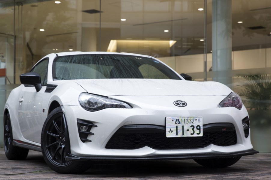 A white Toyota 86 on display at a dealership