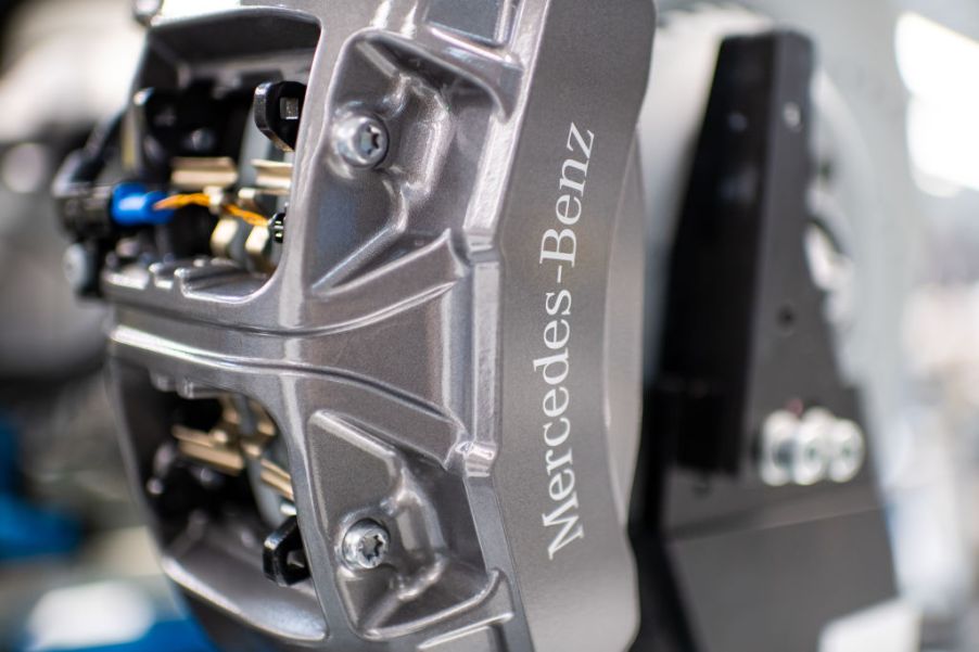 A close-up of a silver Mercedes-Benz brake caliper