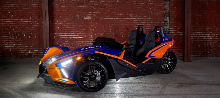 An image of a 2021 Polaris Slingshot parked inside.