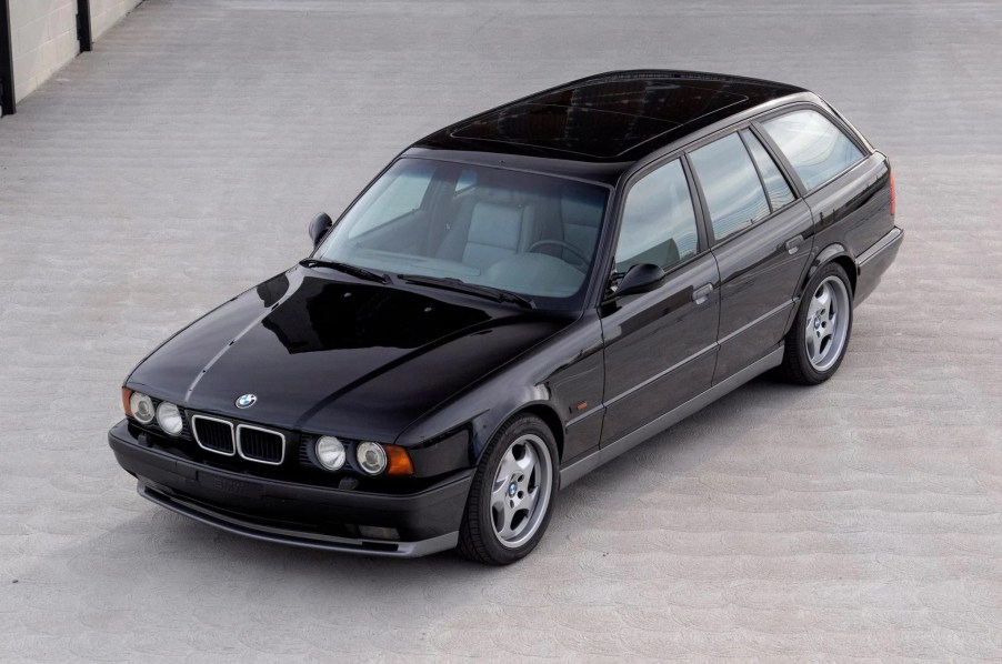 An overhead-angle view of a black 1992 BMW M5 Touring in a parking lot