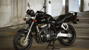 A black 1994 Honda CB1000 Super Four in a parking garage