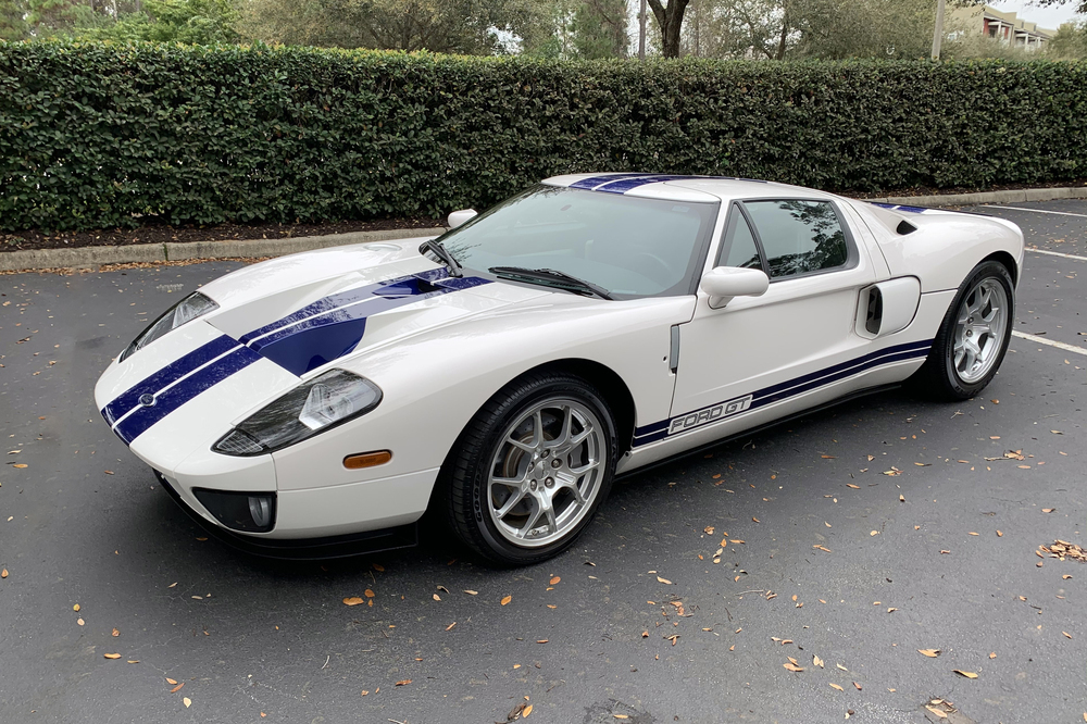 A white 2005 Ford GT with blue stripes