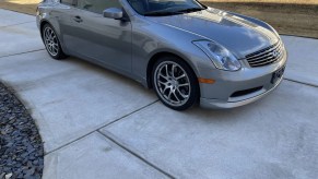 A metallic-gray 2005 Infiniti G35 Coupe parked on a driveway