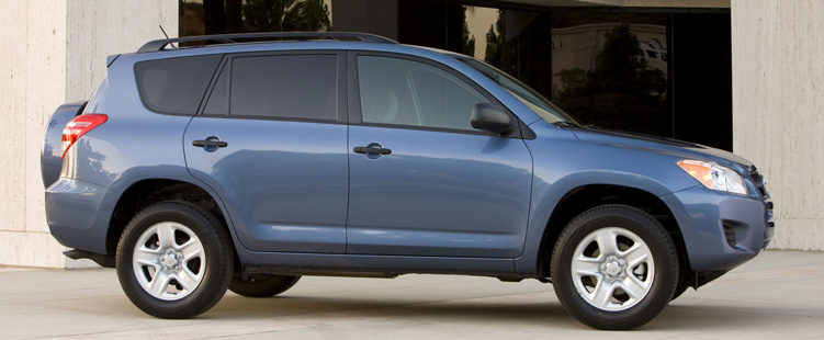 A blue 2011 Toyota RAV4 parked on display