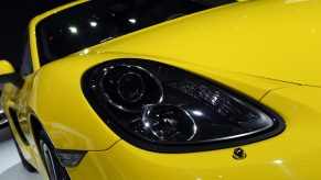 Closeup of a yellow 2014 Porsche Cayman coupe