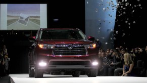 A burgundy 2014 Toyota Highlander midsize crossover SUV is unveiled during the 2013 New York International Auto Show on Wednesday, March 27, 2013