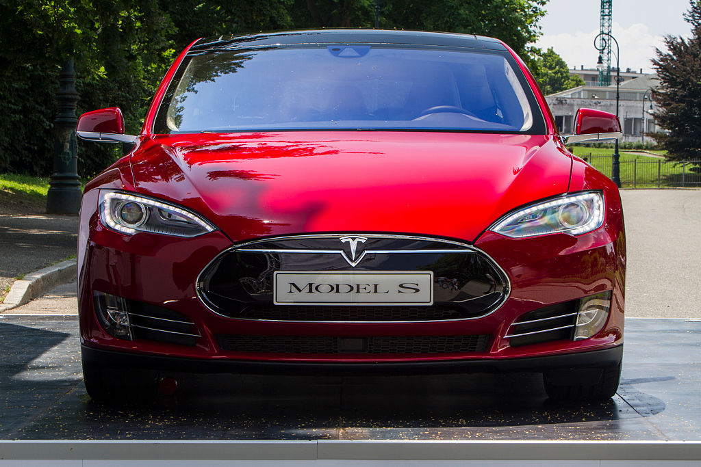 Front-end view of a red 2015 Tesla Model S