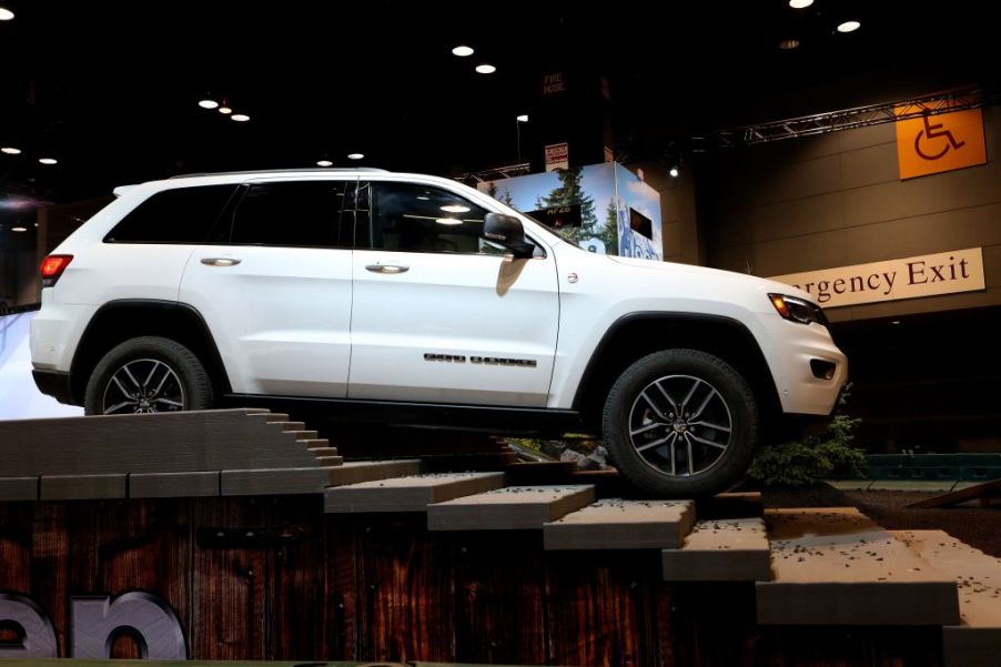 A white 2018 Jeep Grand Cherokee on display